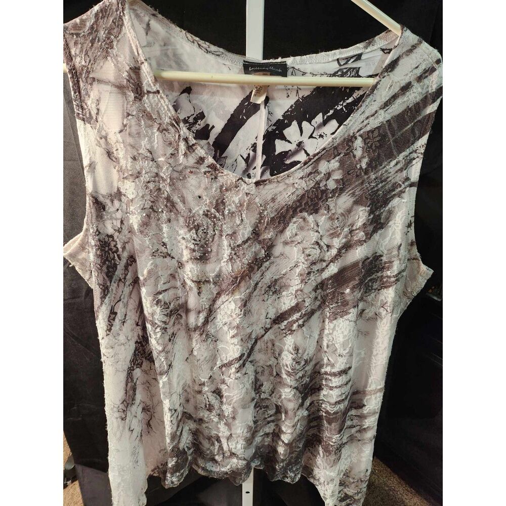 Channel Timeless Elegance with the Brittany Black Ombré Lace Tank Top